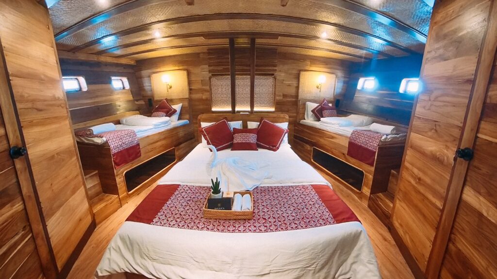 Angelica family cabin with a shared layout of red patterned beds