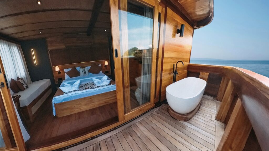 Angelica's private balcony with a freestanding oval bathtub beside the bedroom