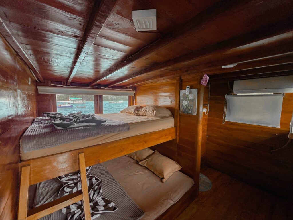 Master family suite with bunk beds and a small window