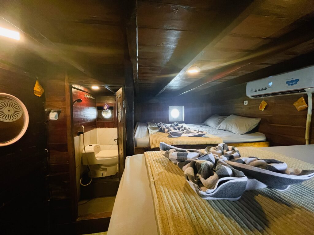 Capt Octopus standard cabin layout with multiple beds beside the ensuite