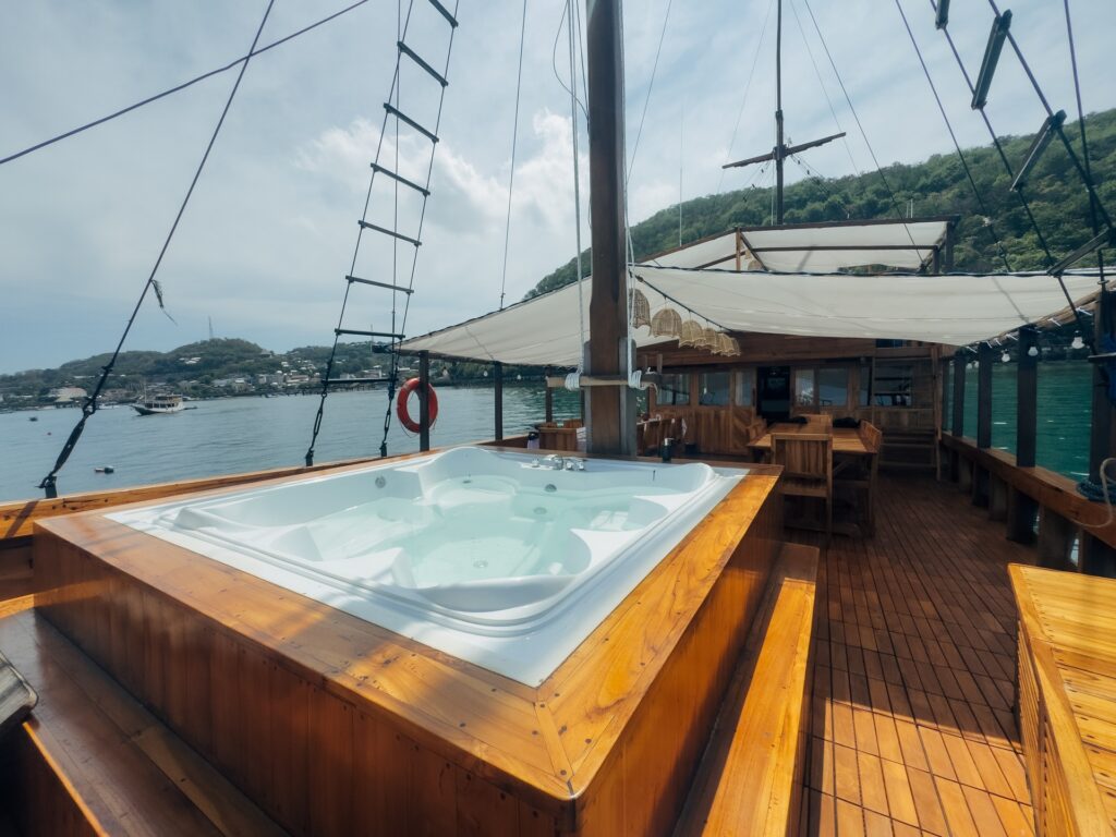 Deck jacuzzi on the Carnaby II with other boats visible in the bay