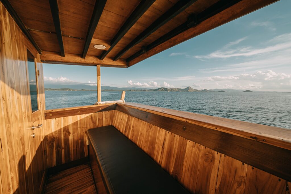 Wooden private balcony bench outside the owners suite with an open ocean view