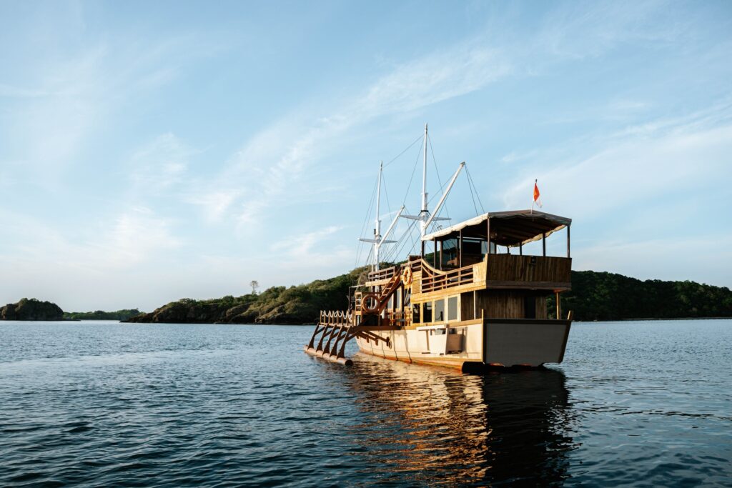 The Jofiel anchored near the green hills of Sebayur Island