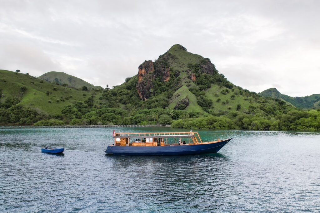 Open deck boat near Manjarite Island with a small boat alongside