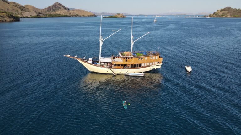 Leticia komodo liveaboard anchored near Bidadari Island in deep blue water