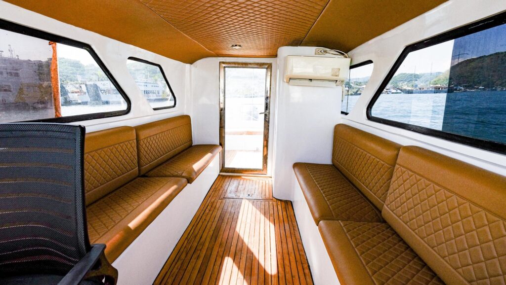 Wide view of the shaded cabin with bench seating along both sides