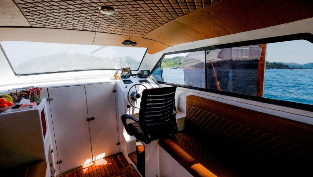 Ocean Manta's cockpit with steering wheel, control panel and captain's chair
