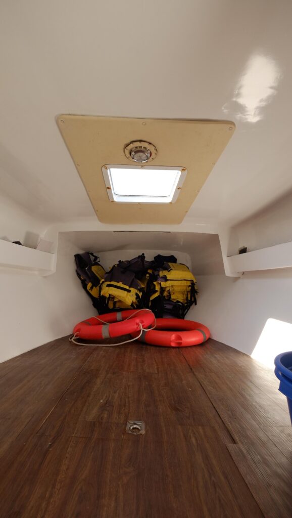 Storage cubby holding life vests and life rings for guest safety