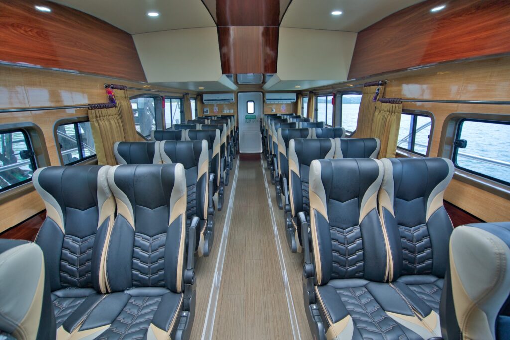 Rows of passenger seats down the center aisle of Ocean Queen's cabin