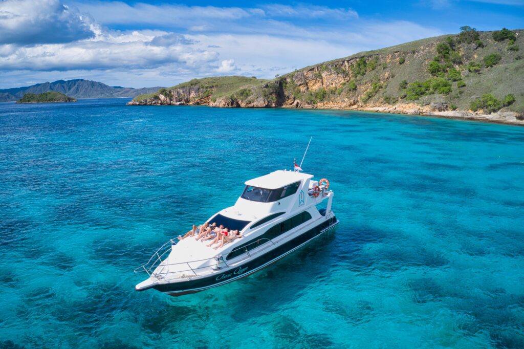 Aerial view of the Ocean Queen komodo speedboat anchored in clear turquoise water