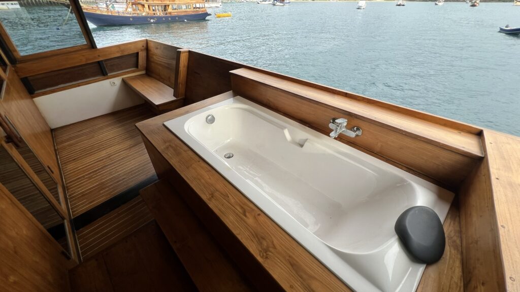 Panrita's outdoor bathtub on a private balcony overlooking the anchored fleet