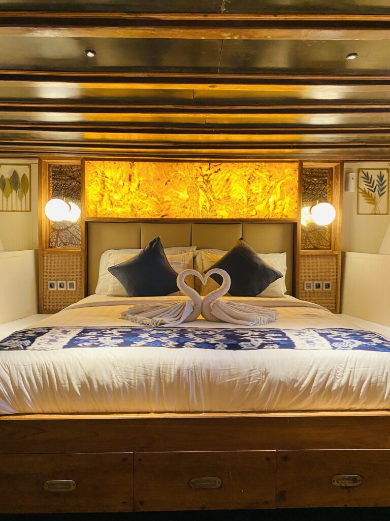 Refviero Superior cabin bed with a backlit headboard and dark blue ikat runner