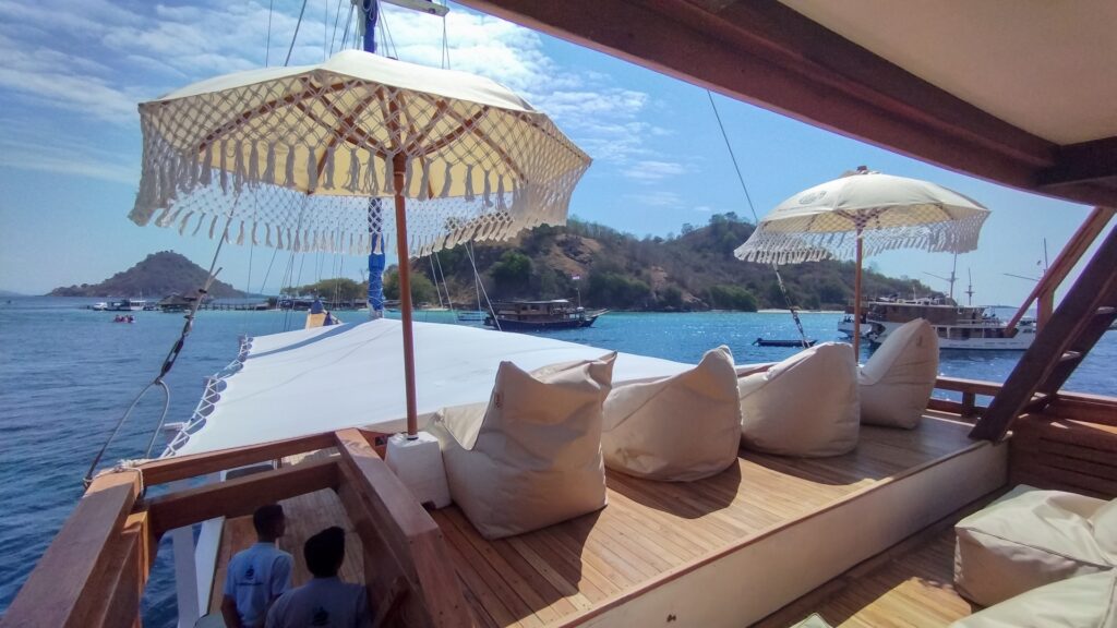 Soe Besar Vanrei's top deck beanbags and umbrella overlooking a small island