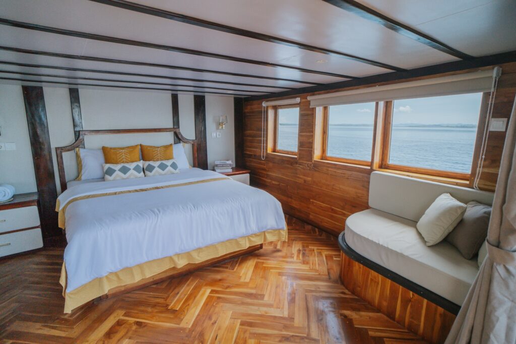Zada Nara's Owner's Suite with floor-to-ceiling windows and a built-in cushioned sofa