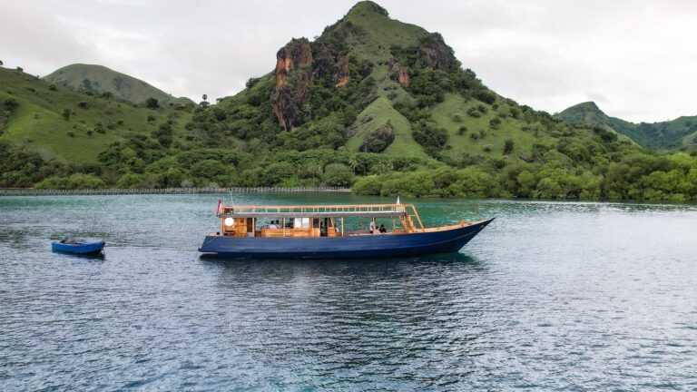 The Kimochi Voyages open-deck boat on a Komodo trip