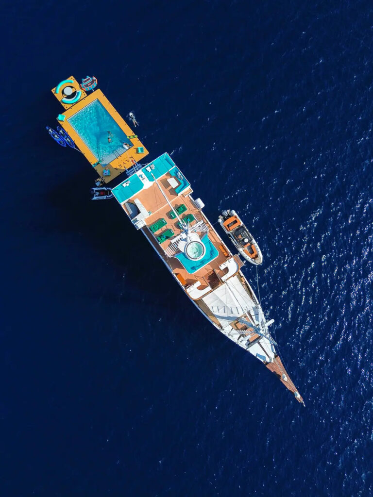 Kayra pool platform in the water alongside the hull, from above