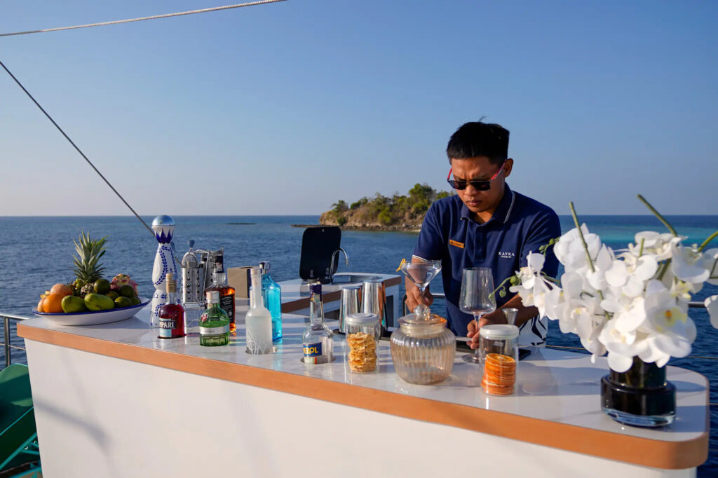 Crew member mixing a cocktail at the Kayra bar
