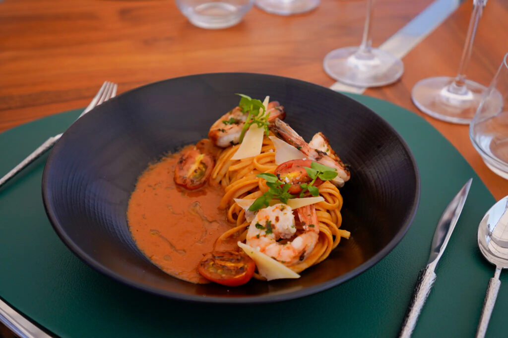 Shrimp pasta plated for lunch aboard Kayra