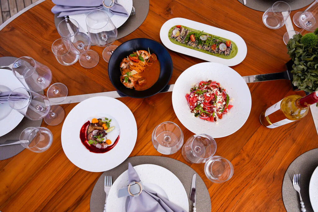 Overhead view of a dining spread laid out aboard Kayra