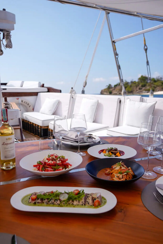 Dining table set with an island view from the Kayra deck