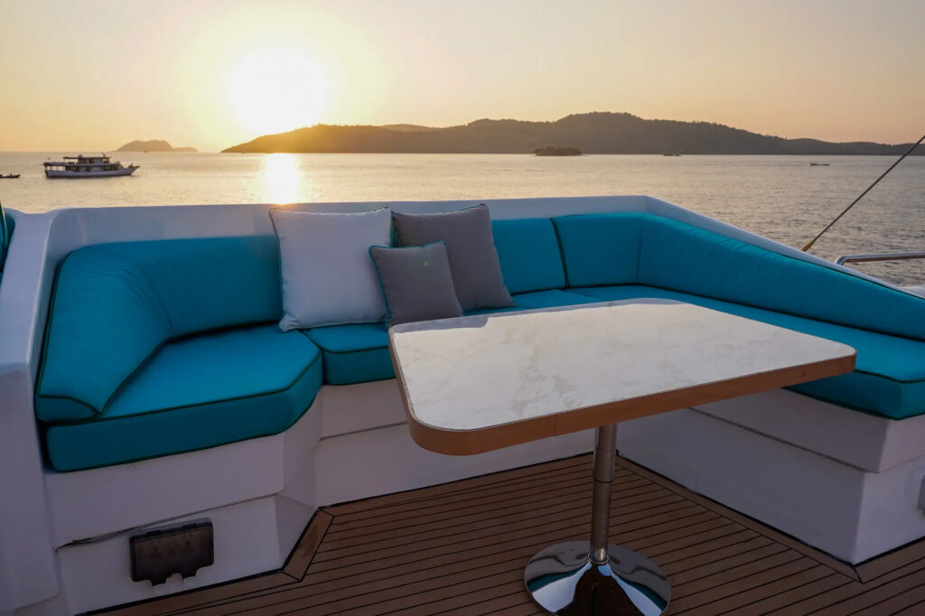 Sun deck lounge at sunset aboard the Kayra phinisi