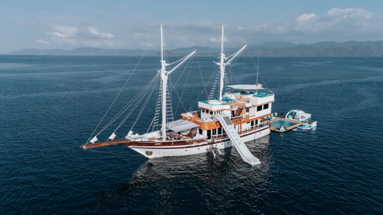Kayra under sail with its pool platform rigged alongside