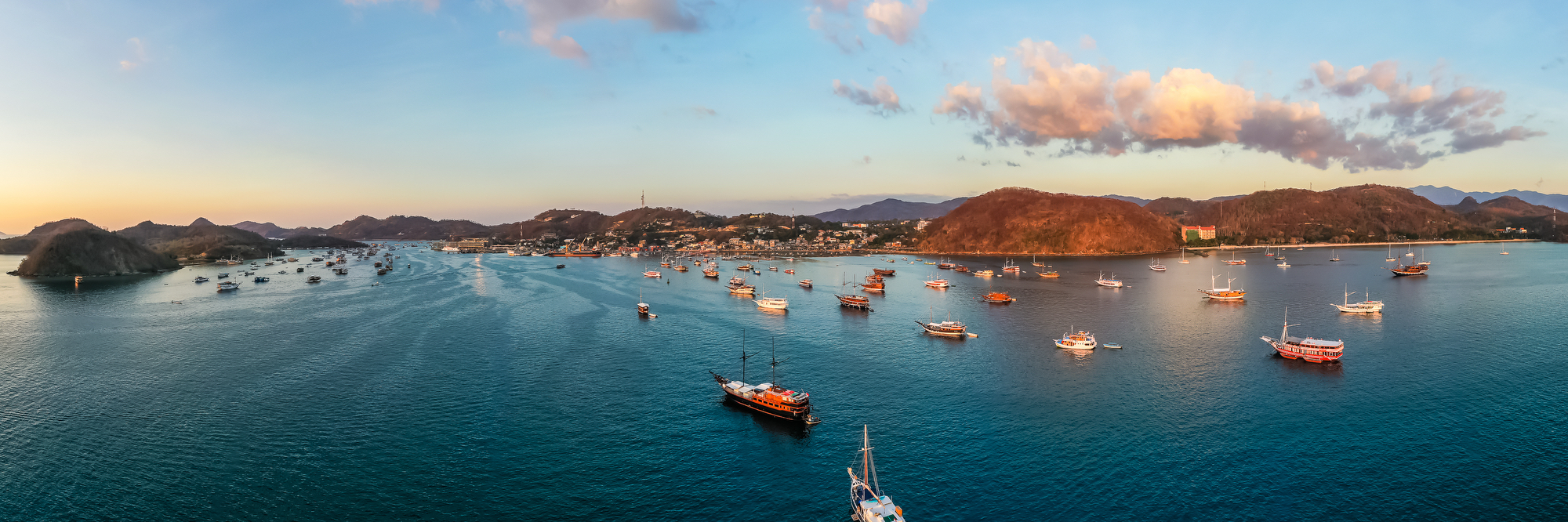 Labuan Bajo harbour at golden hour, start point for a komodo tour 3 days 2 nights